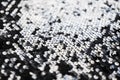 Sequin fabric texture. Shiny silver sparkling background. Clothing piece of glitter metallic for a glamorous party Royalty Free Stock Photo