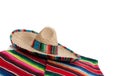 Serape and sombrero on white with copy space Royalty Free Stock Photo