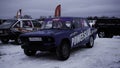 Serbia - Belgrade, December 29, 2022: old parked racing car on snow ground. Clip. Cars at racing competition. Royalty Free Stock Photo