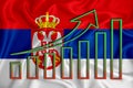 Serbia flag with a graph of price increases for the country`s currency. Rising prices for shares of companies and cryptocurrencie
