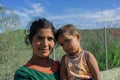 Serbia October 2015: A young Syrian woman holding a child on the border with the European Union