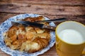 Serbian dish called Burek (cheese pie) served on wooden kitchen table for breakfast