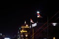 Serbian Flags, night, strong wind on top of state building. Royalty Free Stock Photo