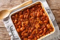 Serbian food: prebranac baked beans with onion close-up in baking dish. horizontal top view from above Royalty Free Stock Photo