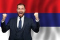 Serbian happy businessman on the background of flag of Serbia Business, education, degree and citizenship concept