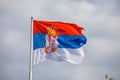 Serbian national flag on wind, outdoor Royalty Free Stock Photo