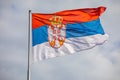 Serbian national flag on wind, outdoor Royalty Free Stock Photo