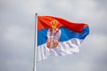 Serbian national flag on wind, outdoor Royalty Free Stock Photo