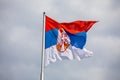 Serbian national flag on wind, outdoor Royalty Free Stock Photo