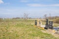 Serbian Orthodox Cemetary of Rastina cut by the Border fence between Serbia