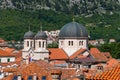 Red tiled roofs of old town houses in Kotor and Serbian Orthodox Church of St. Nikola , Montenegro Royalty Free Stock Photo