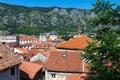 Red tiled roofs of old town houses in Kotor and Serbian Orthodox Church of St. Nikola , Montenegro Royalty Free Stock Photo
