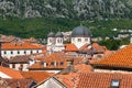 Red tiled roofs of old town houses in Kotor and Serbian Orthodox Church of St. Nikola , Montenegro Royalty Free Stock Photo