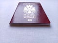 Serbian passport. New biometric document for border crossing. Official documentation. Red and burgundy passport crusts with shiny