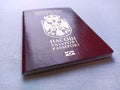 Serbian passport. New biometric document for border crossing. Official documentation. Red and burgundy passport crusts with shiny