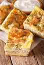 Serbian pie Gibanica with cheese, eggs and greens close-up. Vert Royalty Free Stock Photo