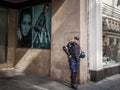 Serbian policeman standing in front of a fashion store with anti riot gear in the center of Belgrade, Serbia, during Gay Pride