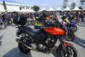 Thousands of motorcycles of all sizes and engine capacities are parked in big parking space. Royalty Free Stock Photo