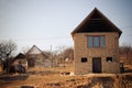 SEREDNIE, UKRAINE - MARCH 09, 2011: living in self-made simple adobe brick home