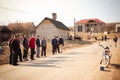 SEREDNIE, UKRAINE - MARCH 09, 2011: young men waiting for bus to work Royalty Free Stock Photo