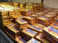 Butter in square packaging is on display in chiller shelves inside the supermarket.