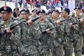 Malaysian soldiers in uniform and fully armed.