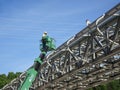 Construction workers using the mobile crane bucket Royalty Free Stock Photo