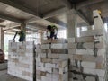 Blockwork by construction workers at the construction site. Royalty Free Stock Photo