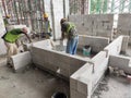 Blockwork by construction workers at the construction site. Royalty Free Stock Photo