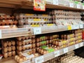 Fresh chicken eggs in a pallet container, for sale in a supermarket. Sort by grade and size.