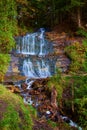 Serene Autumn Waterfall in Lush Michigan Forest Royalty Free Stock Photo