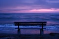 Serene Beach Sunset with Empty Bench, Peaceful Evening Concept Royalty Free Stock Photo