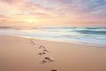 Footprints in Sand, Sunset Beach Scene With Silhouettes Royalty Free Stock Photo