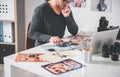 Serious photographer looking at printed images