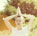 Serene beautiful yoga girl with eyes closed, soft vintage tones