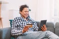 Serene black woman shopping online and electronic banking