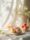 A serene breakfast setting with pastries, fruit, and a refreshing drink by a window Royalty Free Stock Photo