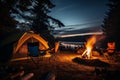 Serene campfire with burning wood, people in chairs, and camping tent amidst the forest beauty