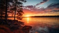 The sun is setting over a lake with rocks and trees Royalty Free Stock Photo