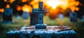 Serene catholic cemetery scene with an engraved grave marker and cross in a softly blurred setting Royalty Free Stock Photo