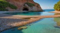 Hidden Cove Paradise: Serene Beach Landscape with Turquoise Water and Coastal Cave Royalty Free Stock Photo