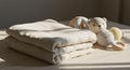Soft Baby Essentials: Stacked Muslin Cloths and Knitted Toys Royalty Free Stock Photo