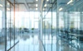 A serene and contemporary office corridor bathed in warm, golden light filtering through panoramic windows, creating a Royalty Free Stock Photo