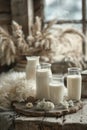A a serene and cozy rustic setting of four milk bottles on a wooden surface