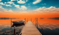 Serene Dawn with a Wooden Pier Extending into a Calm Lake with a Moored Boat Under a Vivid Orange Sky Reflecting in the Still