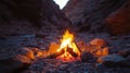 Serene Desert Campfire at Twilight in Rocky Terrain Royalty Free Stock Photo