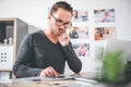 Serene designer choosing images in at desk