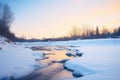 serene dusk light on a half icy-half flowing river