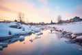 serene dusk light on a half icy-half flowing river