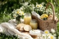 Serene easter picnic in a sunny meadow with fresh lemonade and spring blooms Royalty Free Stock Photo
